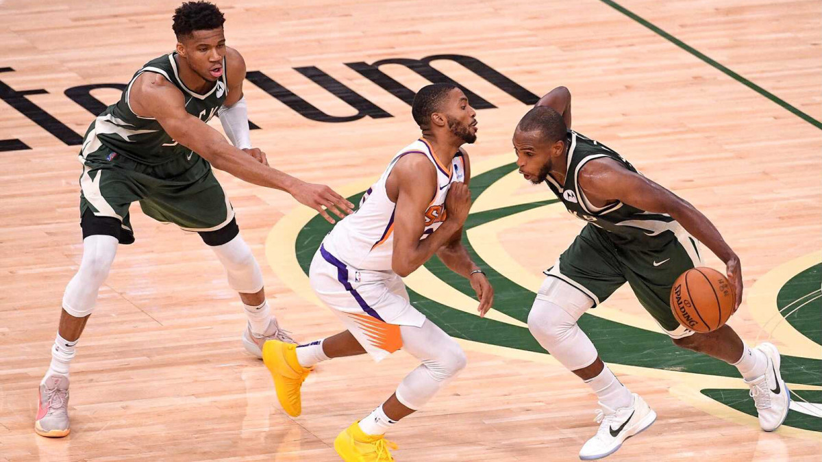 Khris Middleton drives to the hoop against the Suns in the NBA Finals