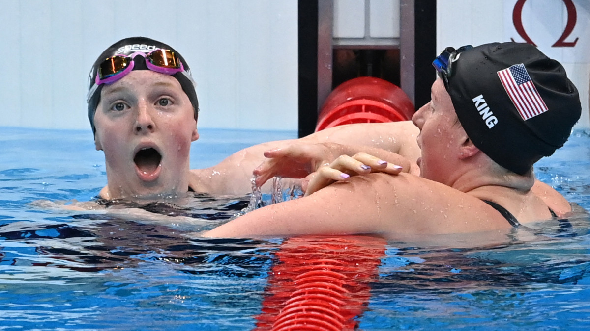 Lydia Jacoby reacts after upsetting Lilly King in the women's 100m breaststroke at the Tokyo Olympics