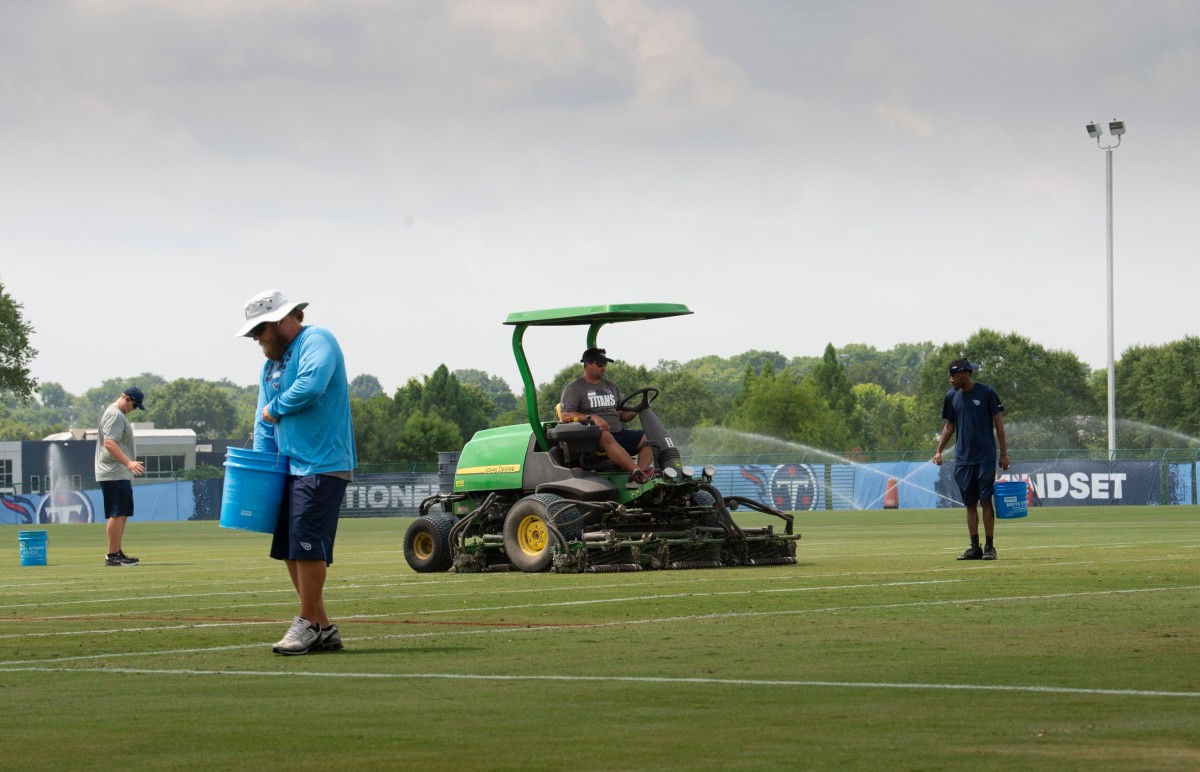 Members of the Titans ground crew prepare the practices fields for the start of training camp at Saint Thomas Sports Park Tuesday, July 27, 2021 in Nashville, Tenn. The Titans hold their first training camp practices on Wednesday.