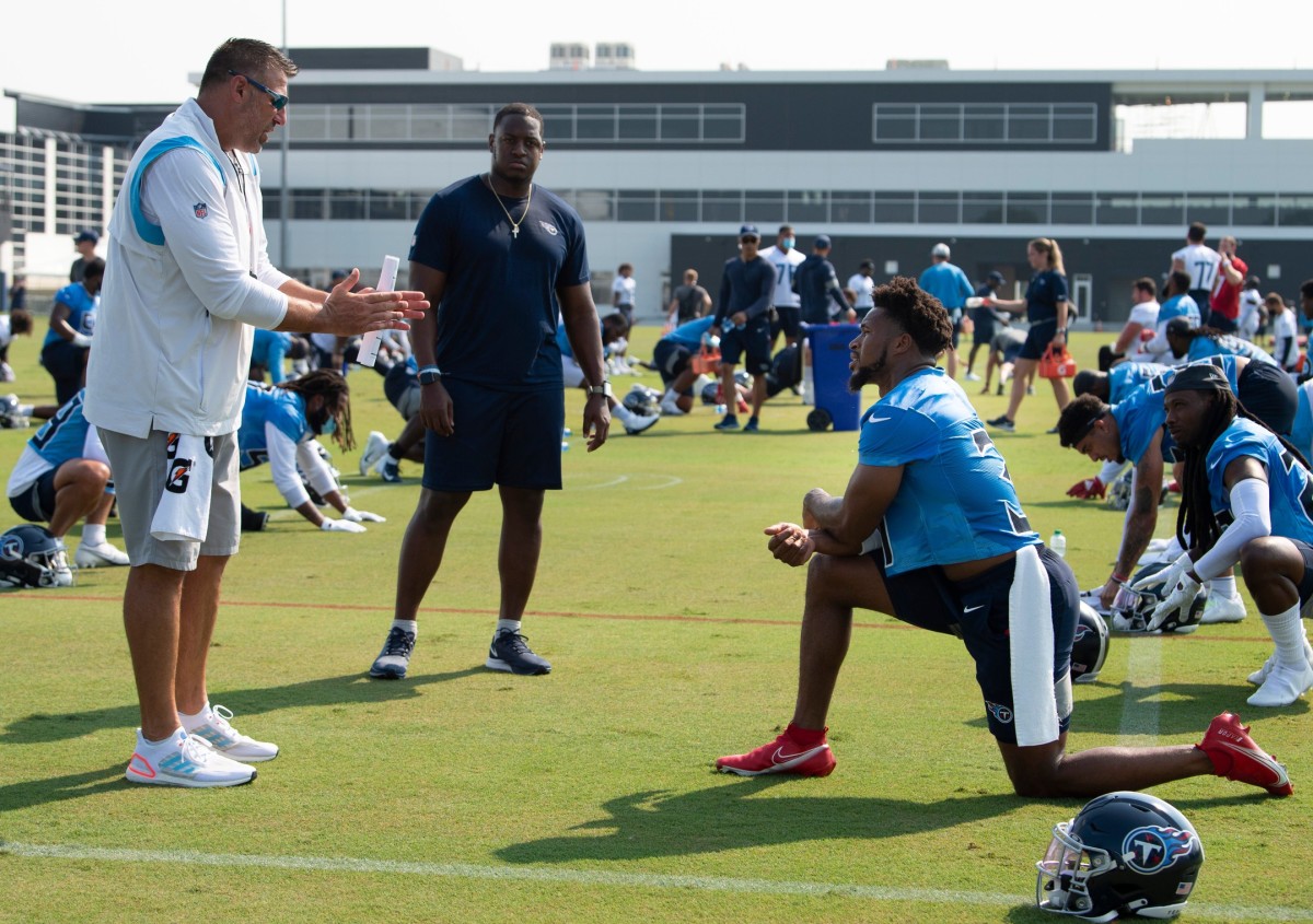 Tennessee Titans head coach Mike Vrabel talks with free safety Kevin Byard (31) as intern Christion Abercrombie listens in during a training camp practice at Saint Thomas Sports Park Wednesday, July 28, 2021 in Nashville, Tenn.