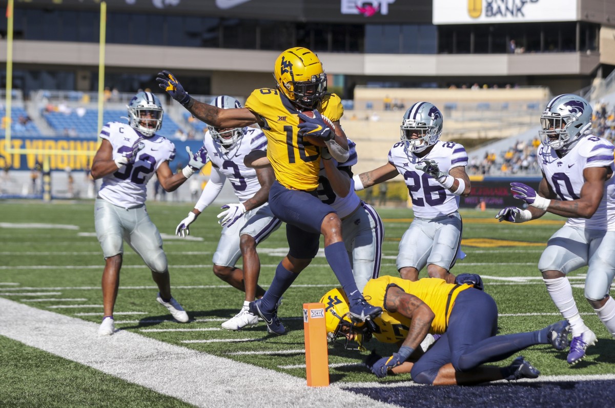 Oct 31, 2020; Morgantown, West Virginia, USA; West Virginia Mountaineers wide receiver Winston Wright Jr. (16) makes a catch and runs for a touchdown during the second quarter against the Kansas State Wildcats at Mountaineer Field at Milan Puskar Stadium.
