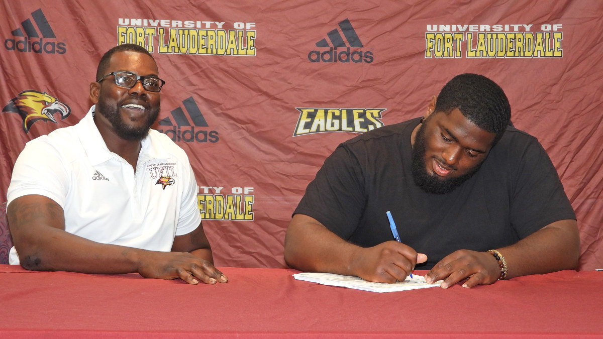 Chris Chambers with a Fort Lauderdale signee