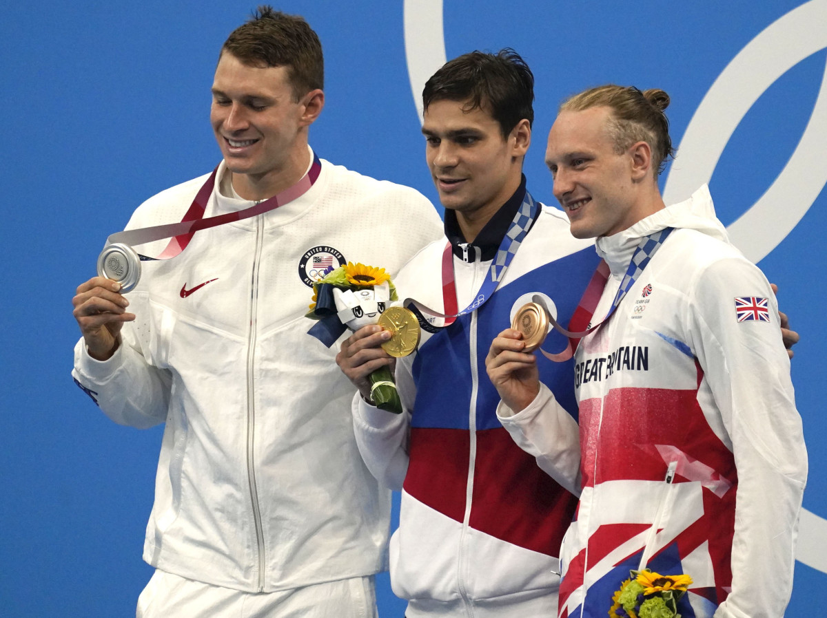 Ryan Murphy (USA), from left, Evgeny Rylov (ROC) and Luke Greenbank (GBR) pose with their medals after taking the top spots in the men's 200 backstroke final during the Tokyo 2020 Olympic Summer Games
