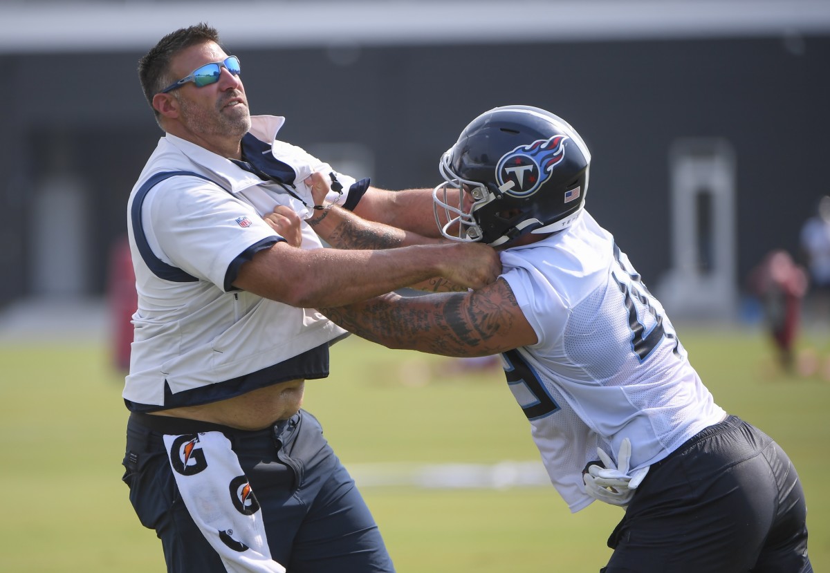 Tennessee Titans linebacker Justin March (45) works with Tennessee Titans head coach Mike Vrabel during training camp at Saint Thomas Sports Park.