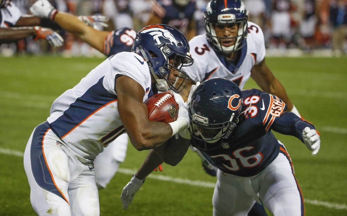 Denver Broncos wide receiver Carlos Henderson (11) is defended by Chicago Bears free safety DeAndre Houston-Carson (36) during the second half at Soldier Field.