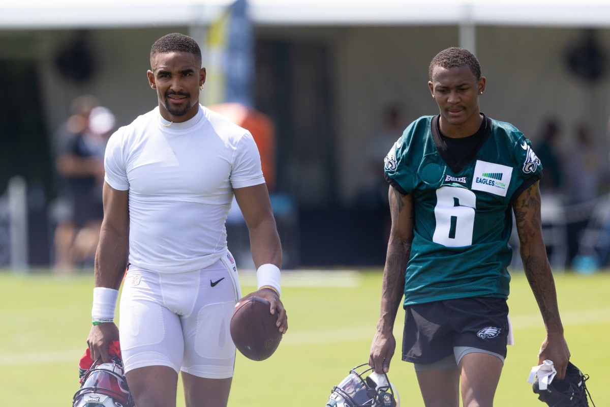 Jalen Hurts (left) and DeVonta Smith leave the field after a recent Eagles training camp practice
