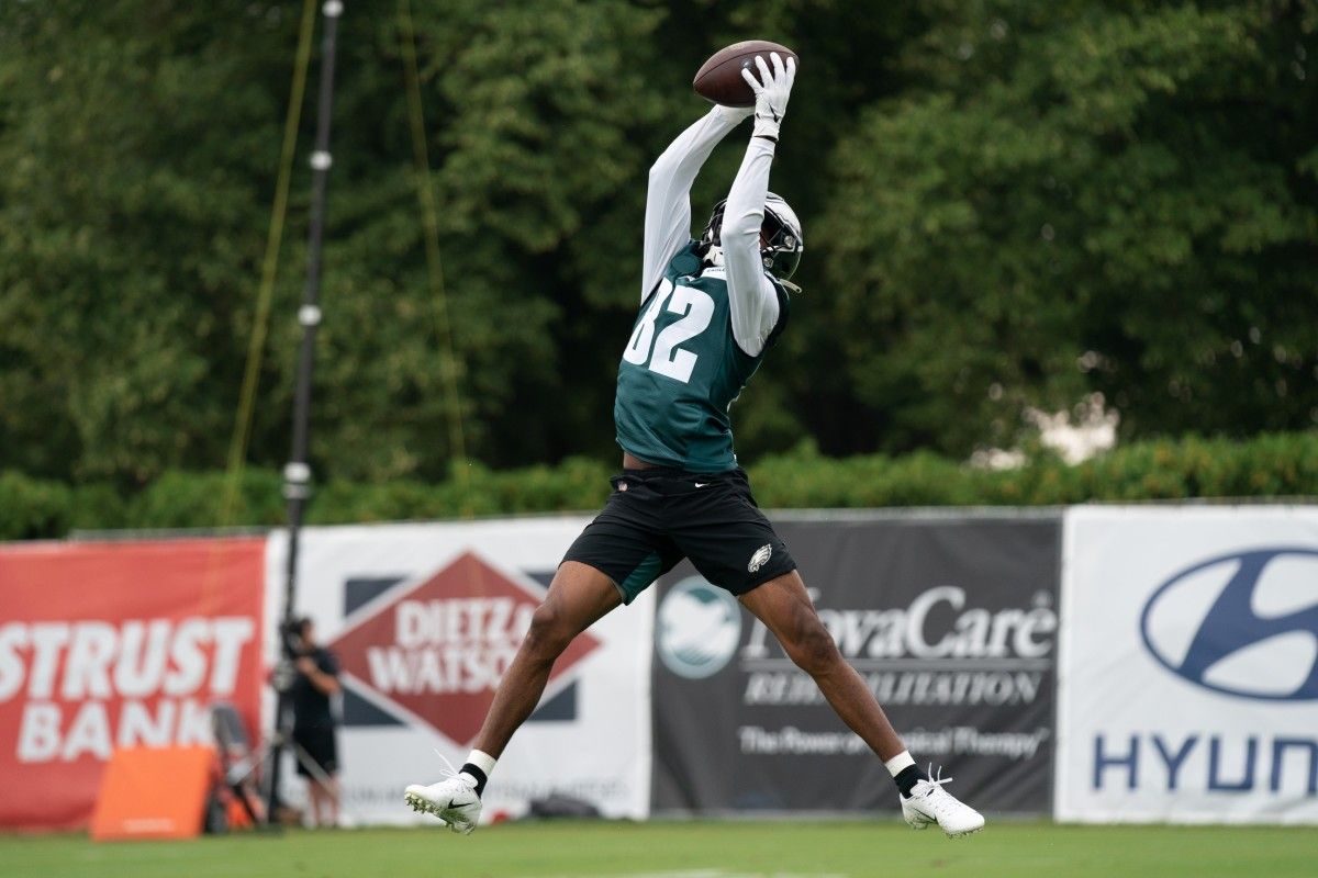 John Hightower reaches up to make a catch at Eagles camp