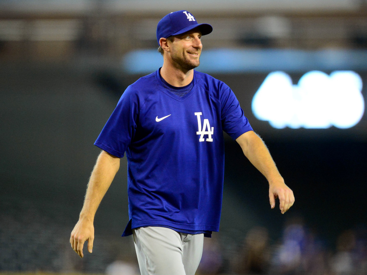 Aug 1, 2021; Phoenix, Arizona, USA; Los Angeles Dodgers starting pitcher Max Scherzer (31) celebrates the 13-0 victory against the Arizona Diamondbacks at Chase Field.