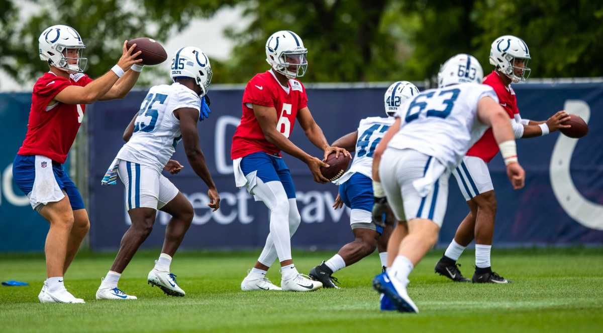 Indianapolis Colts quarterbacks and running backs run through drills during practice Saturday, July 31, 2021.