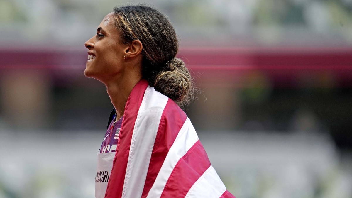 Sydney McLaughlin (USA) celebrates winning the gold medal in the women's 400m hurdles final during the Tokyo 2020 Olympic Summer Games at Olympic Stadium.