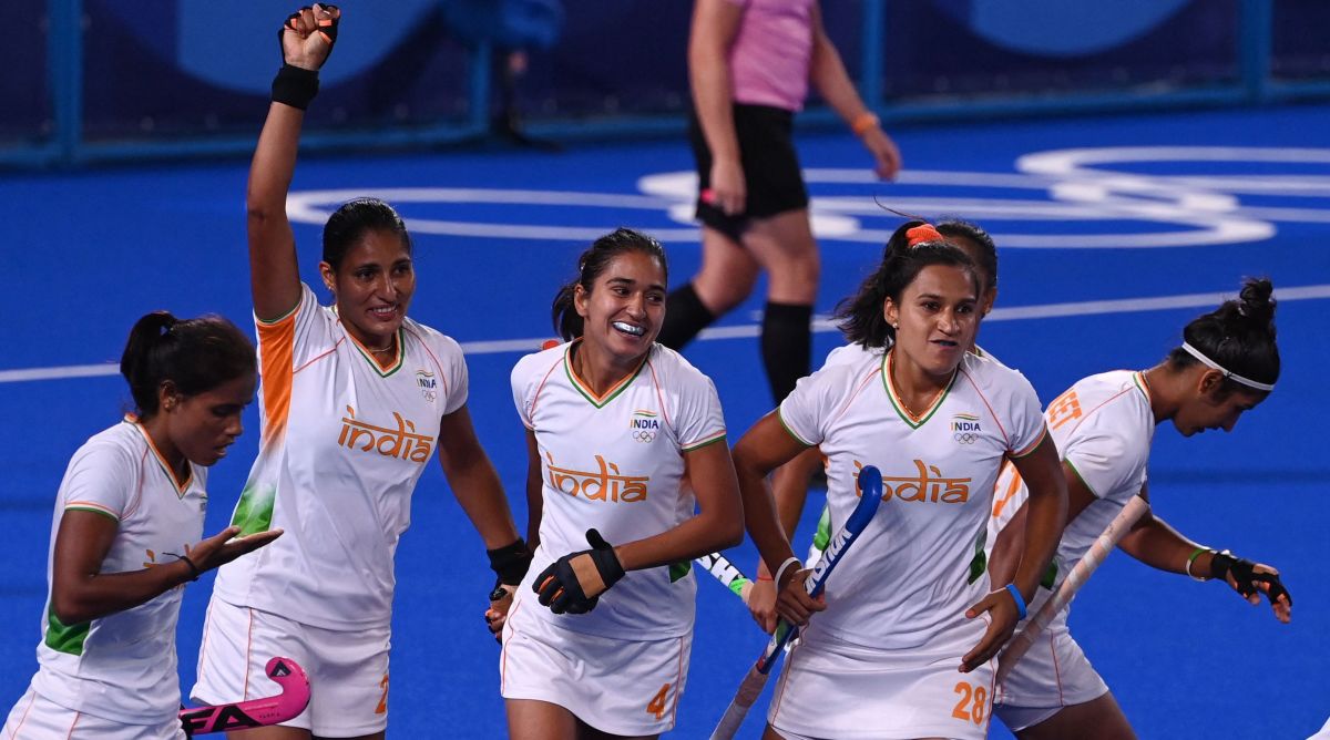 India's Gurjit Kaur (2-L) celebrates with teammates after scoring against Argentina during their women's semi-final match of the Tokyo 2020 Olympic Games field hockey competition, at the Oi Hockey Stadium in Tokyo, on August 4, 2021.
