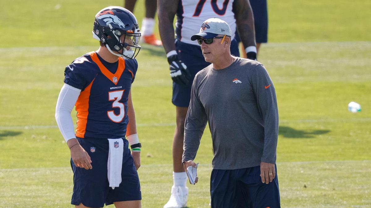 Denver Broncos quarterback Drew Lock (3) talks with offensive coordinator Pat Shurmur during training camp at UCHealth Training Center.