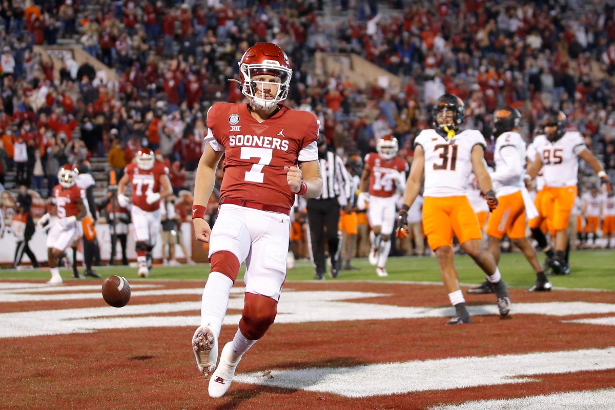 OU quarterback Spencer Rattler scores a touchdown during last season's Bedlam game. If the Sooners leave the Big 12, could the Bedlam series against the Cowboys survive?