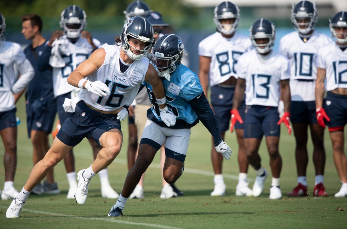 Tennessee Titans wide receiver Cody Hollister (16) speeds past defensive back Chris Jackson (35) during a training camp practice at Saint Thomas Sports Park Monday, Aug. 2, 2021 in Nashville, Tenn.