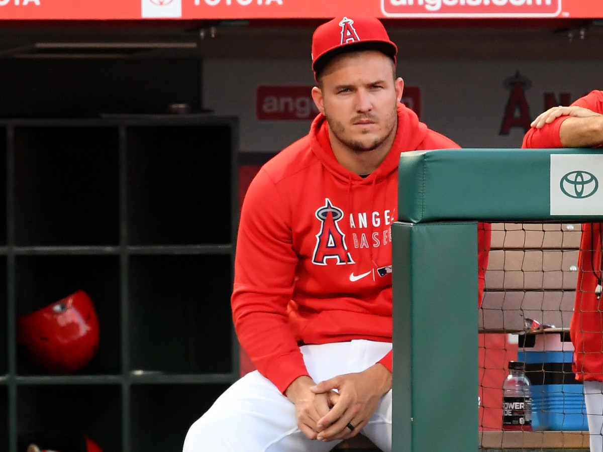 Mike Trout looks on from the dugout