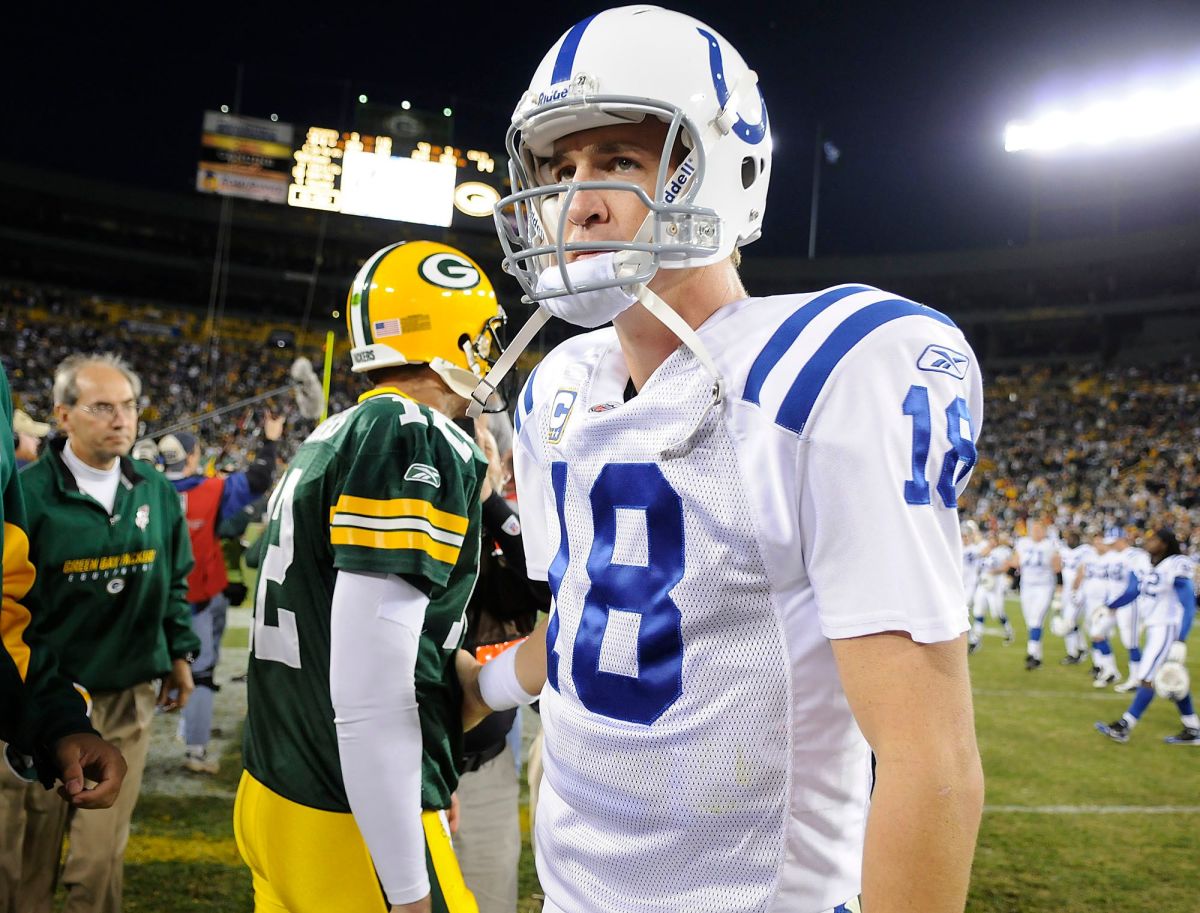 Indianapolis Colts quarterback Peyton Manning (18) turns away after greeting Green Bay Packers quarterback Aaron Rodgers (12) at mid-field after their 2008 game at Lambeau Field. Green Bay Press-Gazette photo. Es Packers Vs Colts 10 19 08