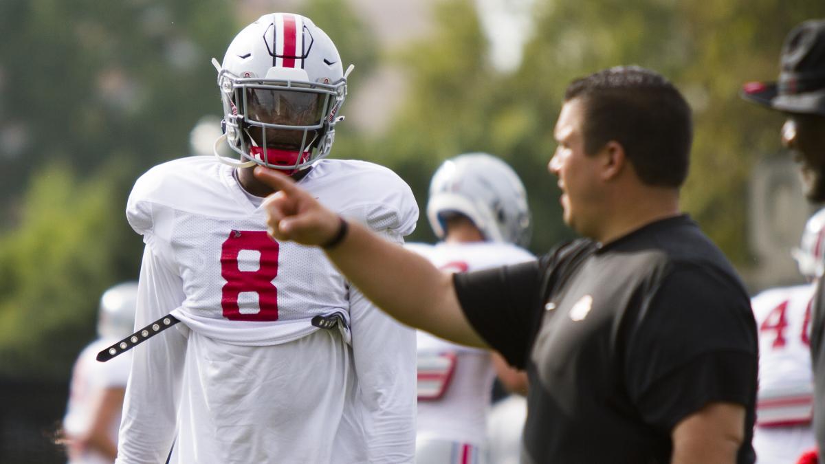 Defensive end Javontae Jean-Baptiste and assistant coach Joe Lyberger