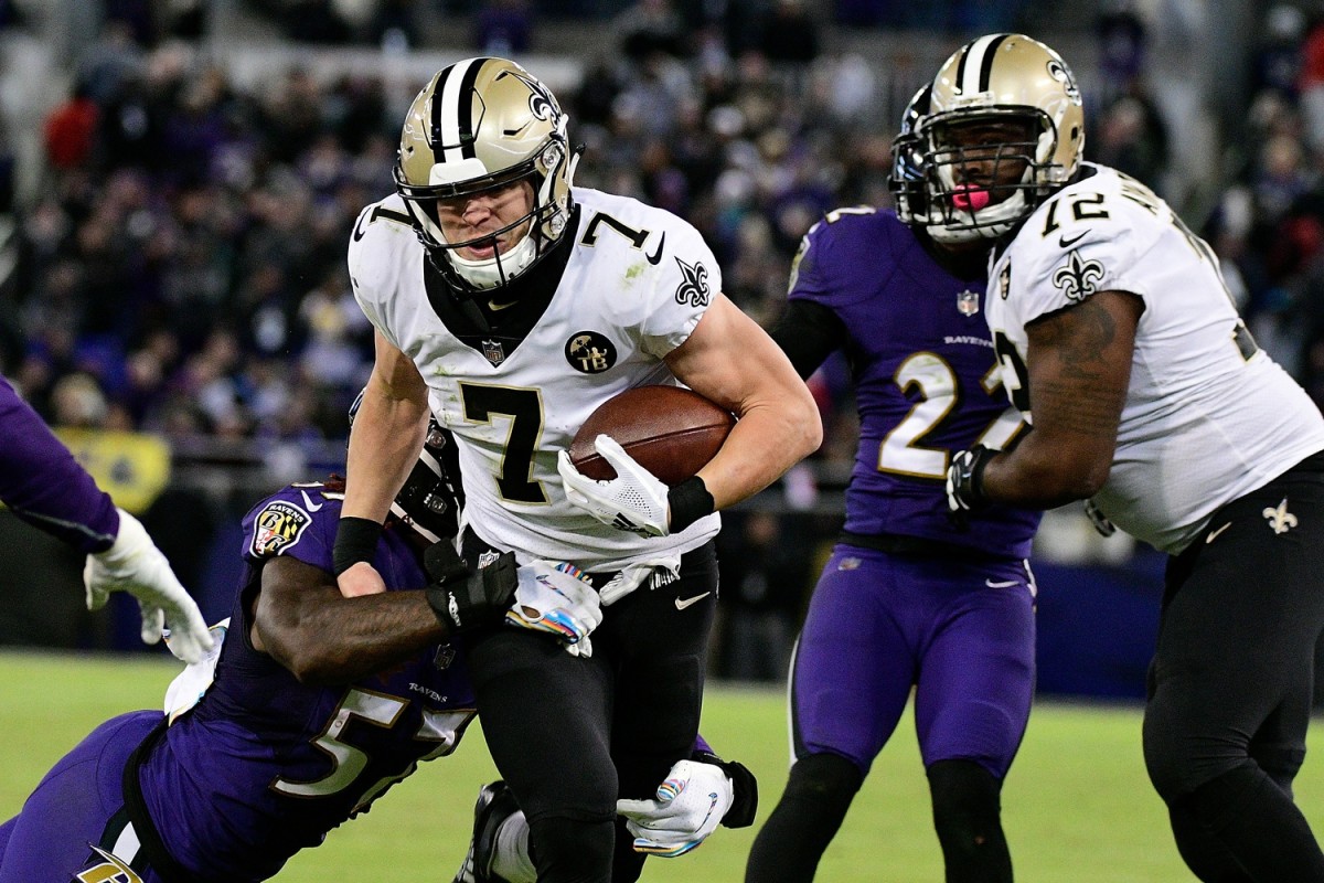 New Orleans Saints quarterback Taysom Hill (7) runs for a first down against the Baltimore Ravens. Mandatory Credit: Tommy Gilligan-USA TODAY Sports