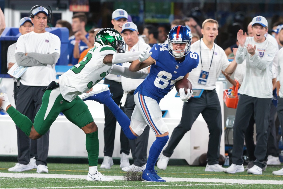 Aug 14, 2021; East Rutherford, New Jersey, USA; New York Giants wide receiver David Sills (84) is tackled by New York Jets cornerback Lamar Jackson (38) during the first half at MetLife Stadium.