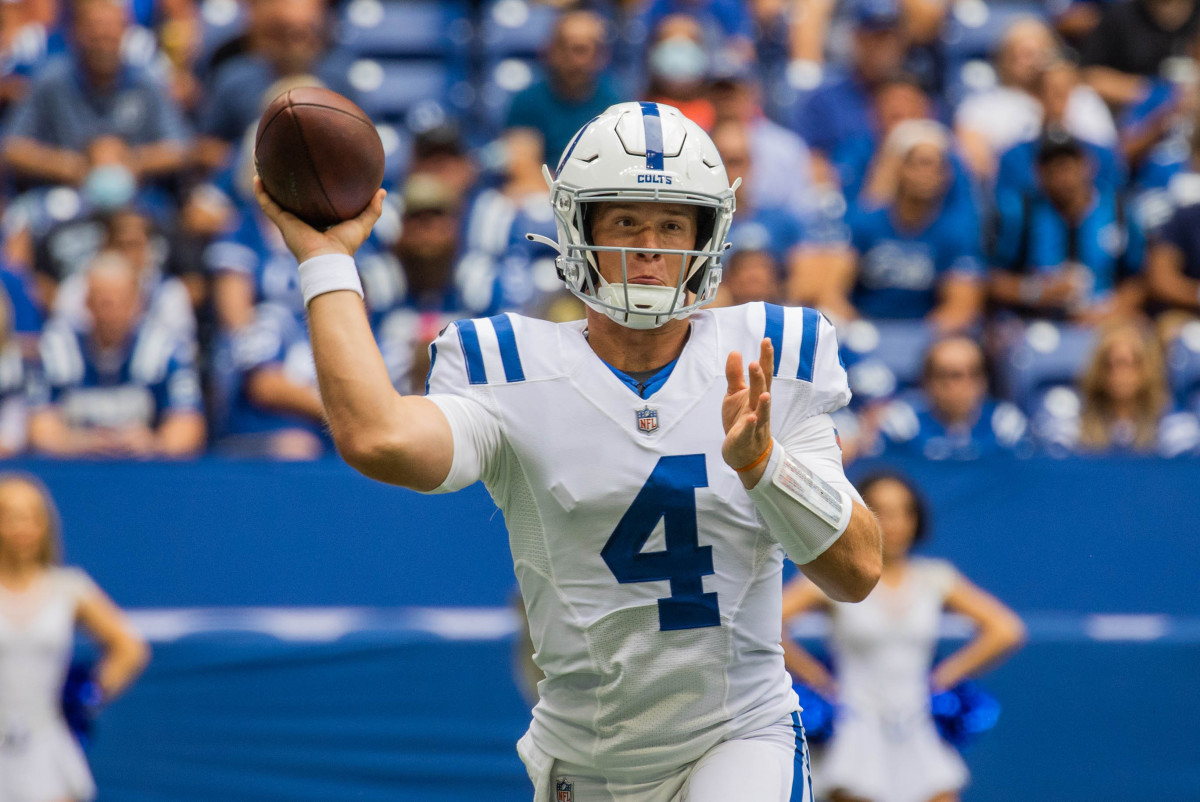 Aug 15, 2021; Indianapolis, Indiana, USA; Indianapolis Colts quarterback Sam Ehlinger (4) passes the ball in the second half against the Carolina Panthers at Lucas Oil Stadium. Mandatory Credit: Trevor Ruszkowski-USA TODAY Sports