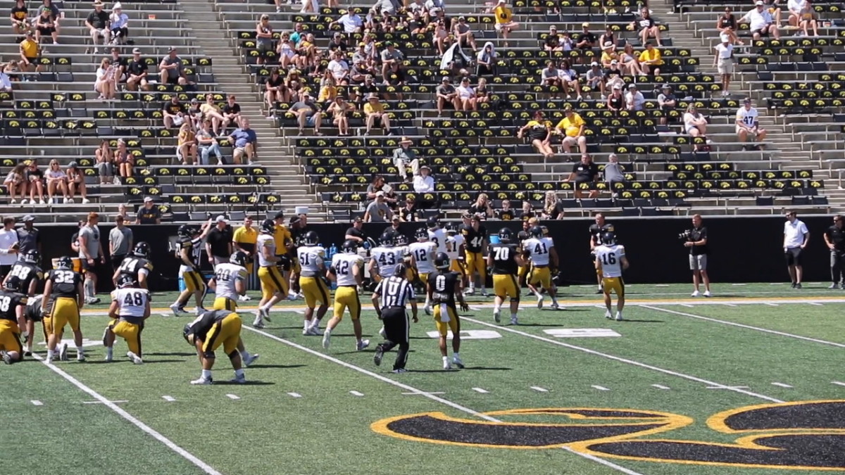 The Iowa football team scrimmages during the 2021 'Kids at Kinnick' event.
