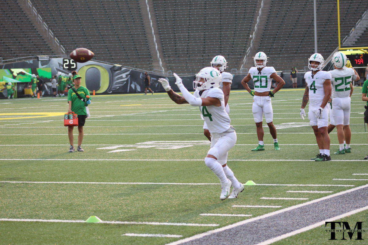 Huston tracks a football as he goes through drills at Oregon fall camp.