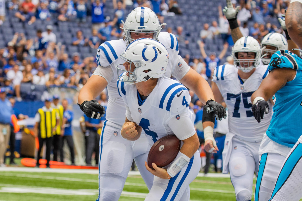 Aug 15, 2021; Indianapolis, Indiana, USA; Indianapolis Colts quarterback Sam Ehlinger (4) celebrates his two-point conversion in the second half against the Carolina Panthers at Lucas Oil Stadium.