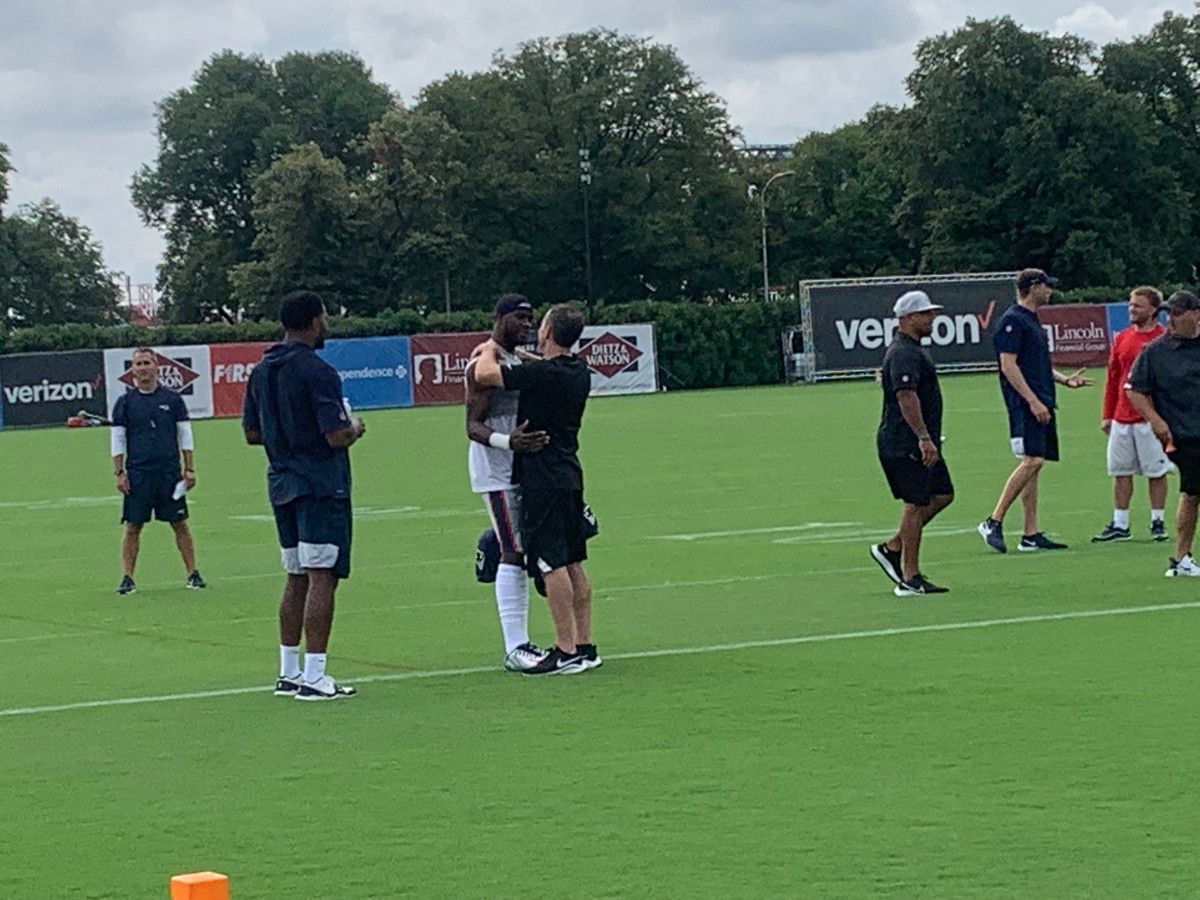 Nelson Agholor and Eagles GM Howie Roseman embrace prior to Monday's practice