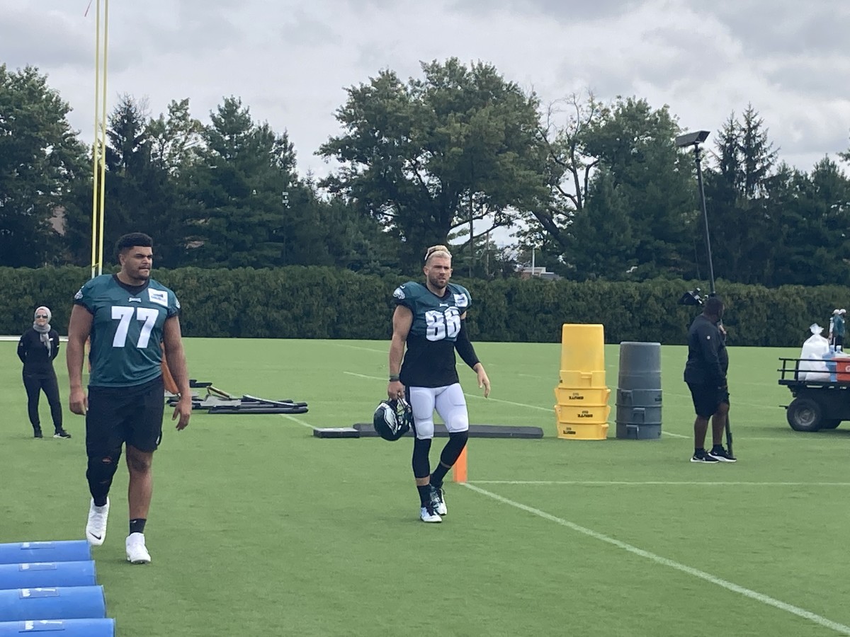 Andre Dillard (left) and Zach Ertz take the field to practice against the Patriots on Aug. 16, 2021