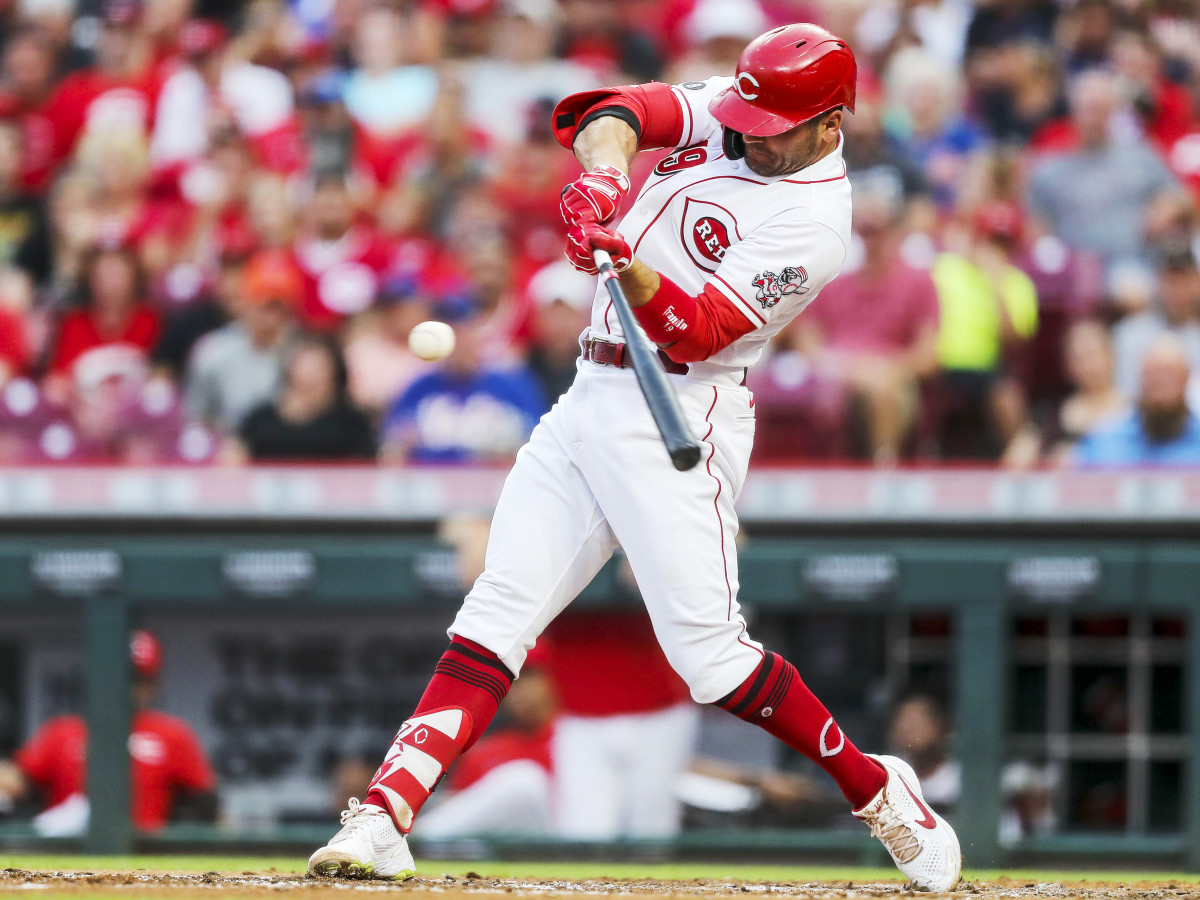 Jul 20, 2021; Cincinnati, Ohio, USA; Cincinnati Reds first baseman Joey Votto (19) hits a solo home run against the New York Mets in the third inning at Great American Ball Park.