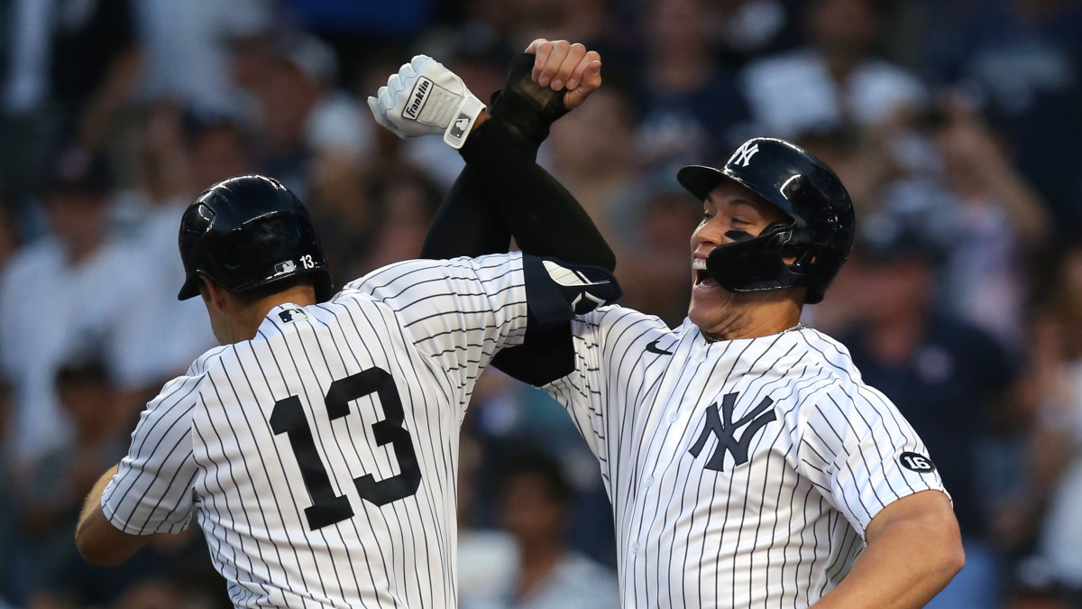 New York Yankees left fielder Joey Gallo (13) celebrates his two-run home run against the Los Angeles Angels with designated hitter Aaron Judge (right) during the first inning at Yankee Stadium.