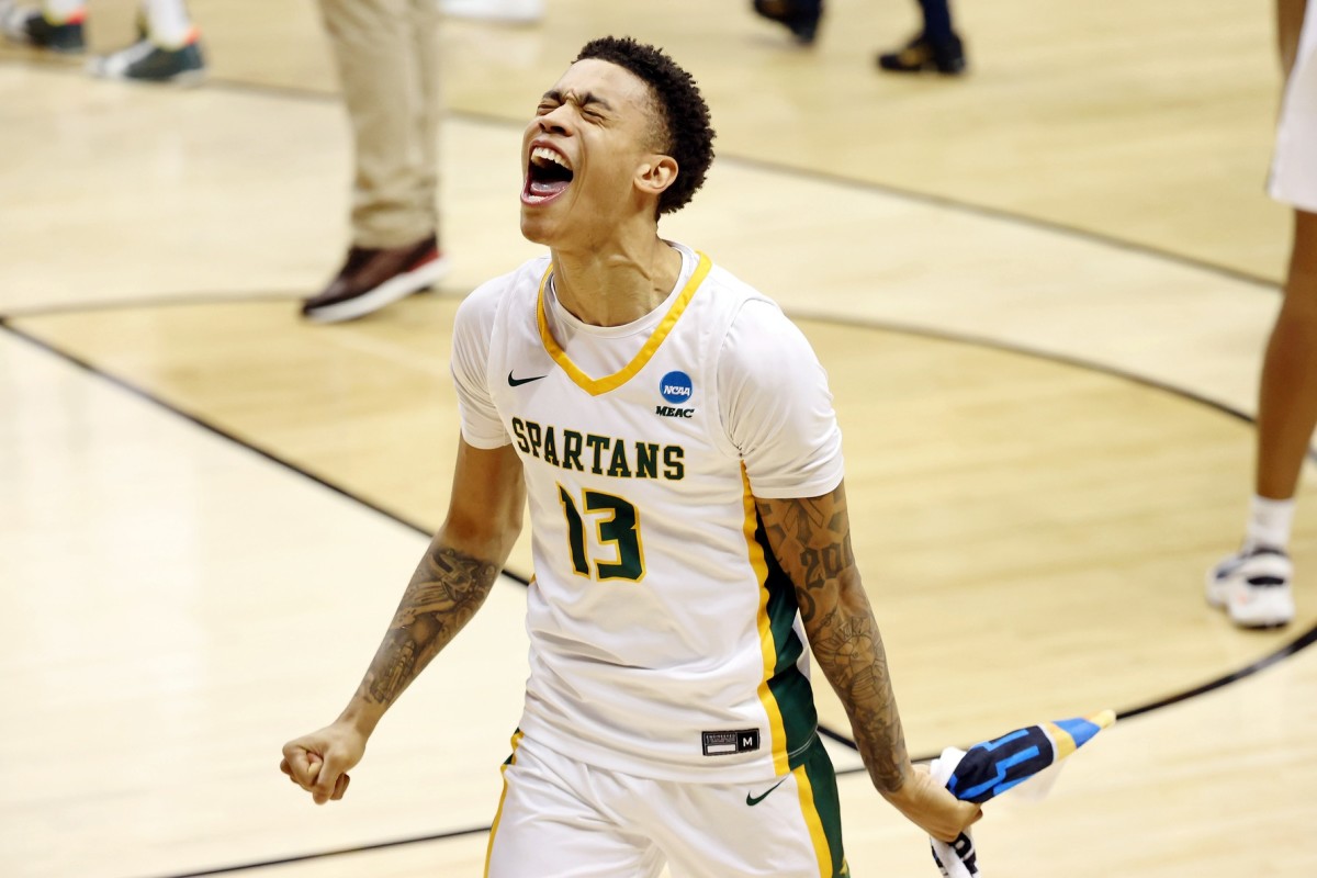 Mar 18, 2021; Bloomington, Indiana, USA; Norfolk State Spartans guard Daryl Anderson (13) celebrates their win over the Appalachian State Mountaineers in the First Four of the 2021 NCAA Tournament at Simon Skjodt Assembly Hall. The Norfolk State Spartans won 54-53. Mandatory Credit: Trevor Ruszkowski-USA TODAY Sports