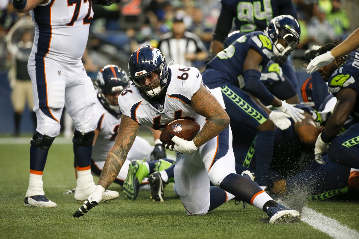 Denver Broncos offensive guard Dalton Risner (66) recovers a fumble for a touchdown against the Seattle Seahawks during the second quarter at Lumen Field.
