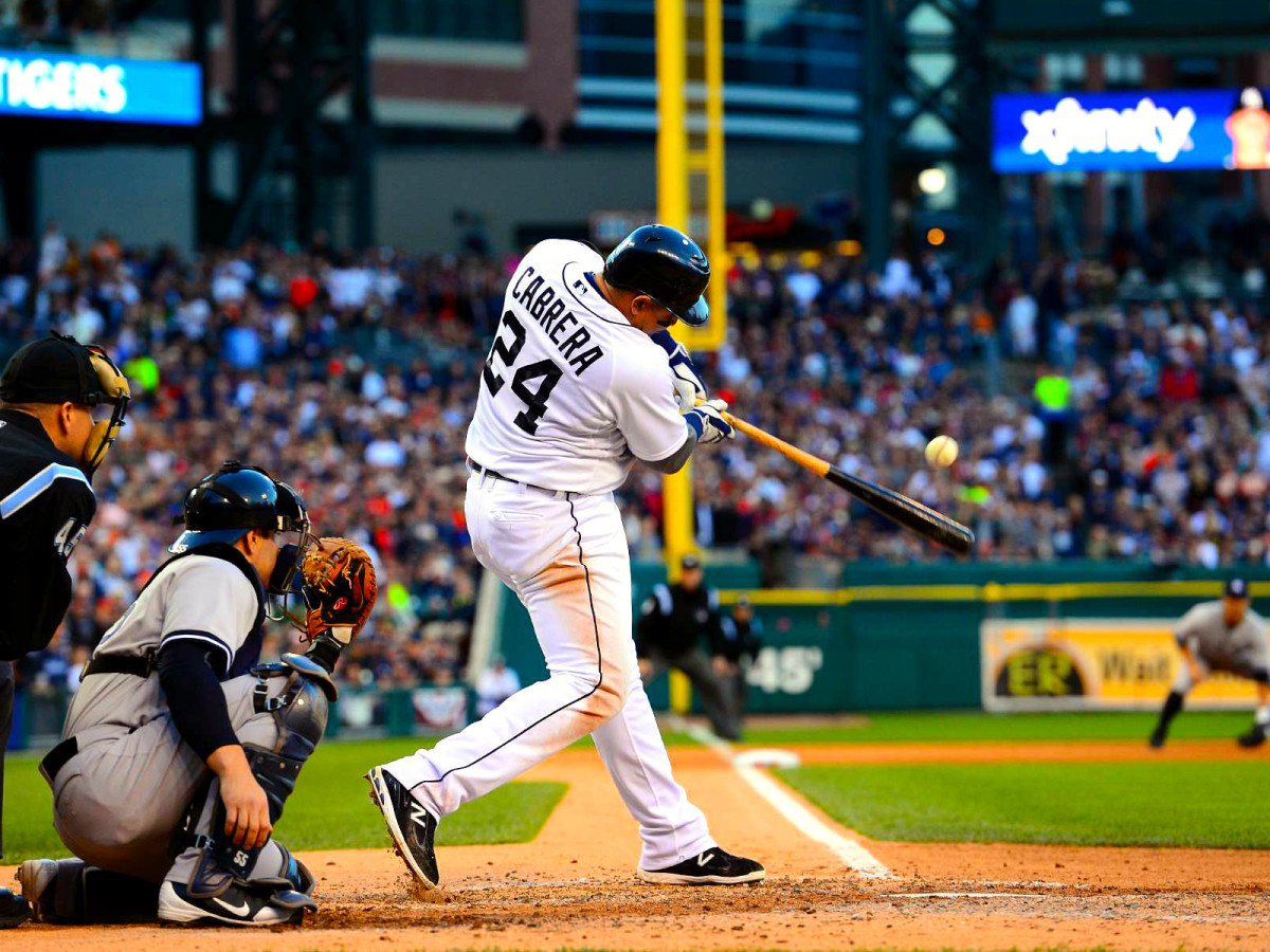 Miguel Cabrera of the Detroit Tigers swings and hits a ball.
