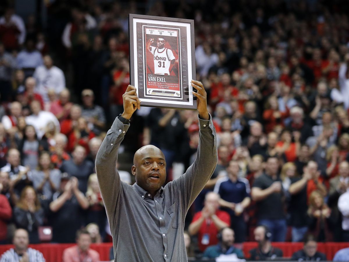 Former Cincinnati Bearcats guard Nick Van Exel is recognized in the second half during the college basketball game.