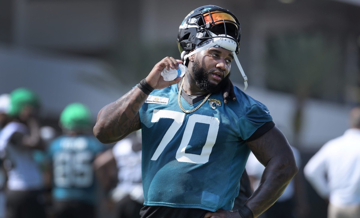 Jaguars T (70) Derwin Gray pours water down his neck as he cools down during a break between drills at Tuesday's minicamp session. The Jacksonville Jaguars held their Tuesday morning session of the team's mandatory minicamp at the practice fields outside TIAA Bank Field, June 15, 2021.