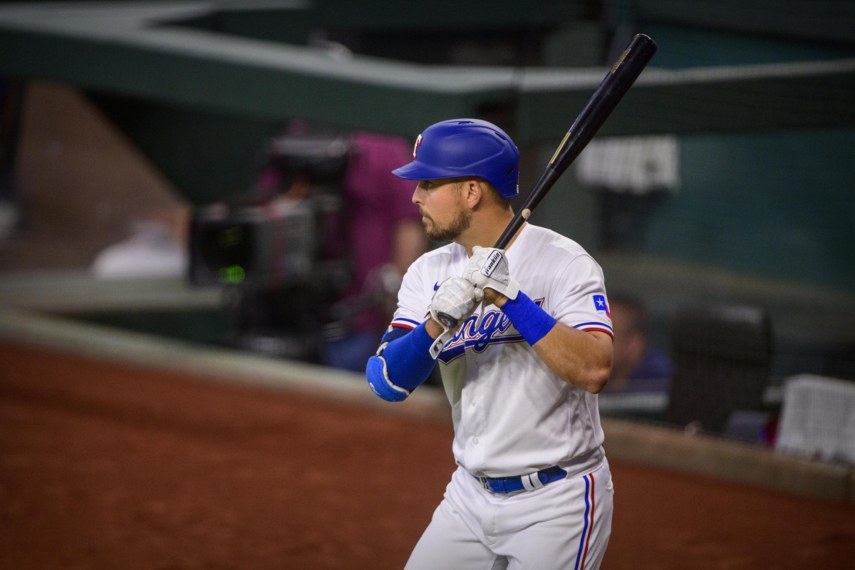 Aug 19, 2021; Arlington, Texas, USA; Texas Rangers first baseman Nathaniel Lowe (30) in action during the game between the Texas Rangers and the Seattle Mariners at Globe Life Field.