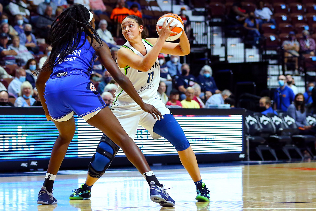 Natalie Achonwa holds a basketball