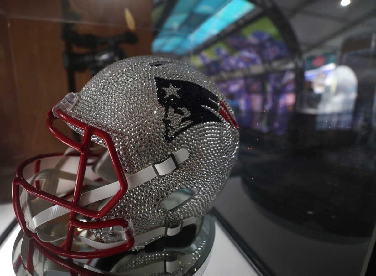 A Rhinestone encrusted New England Patriot helmet is on display at the Locker Room exhibit at the NFL Draft Experience on Thursday April 29, 2021.