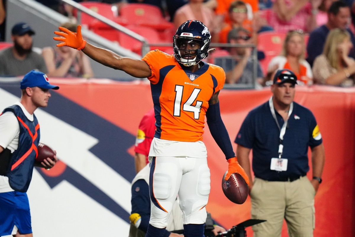 Denver Broncos wide receiver Courtland Sutton (14) celebrates after a first down reception against the Los Angeles Rams in the second quarter during a preseason game at Empower Field at Mile High.