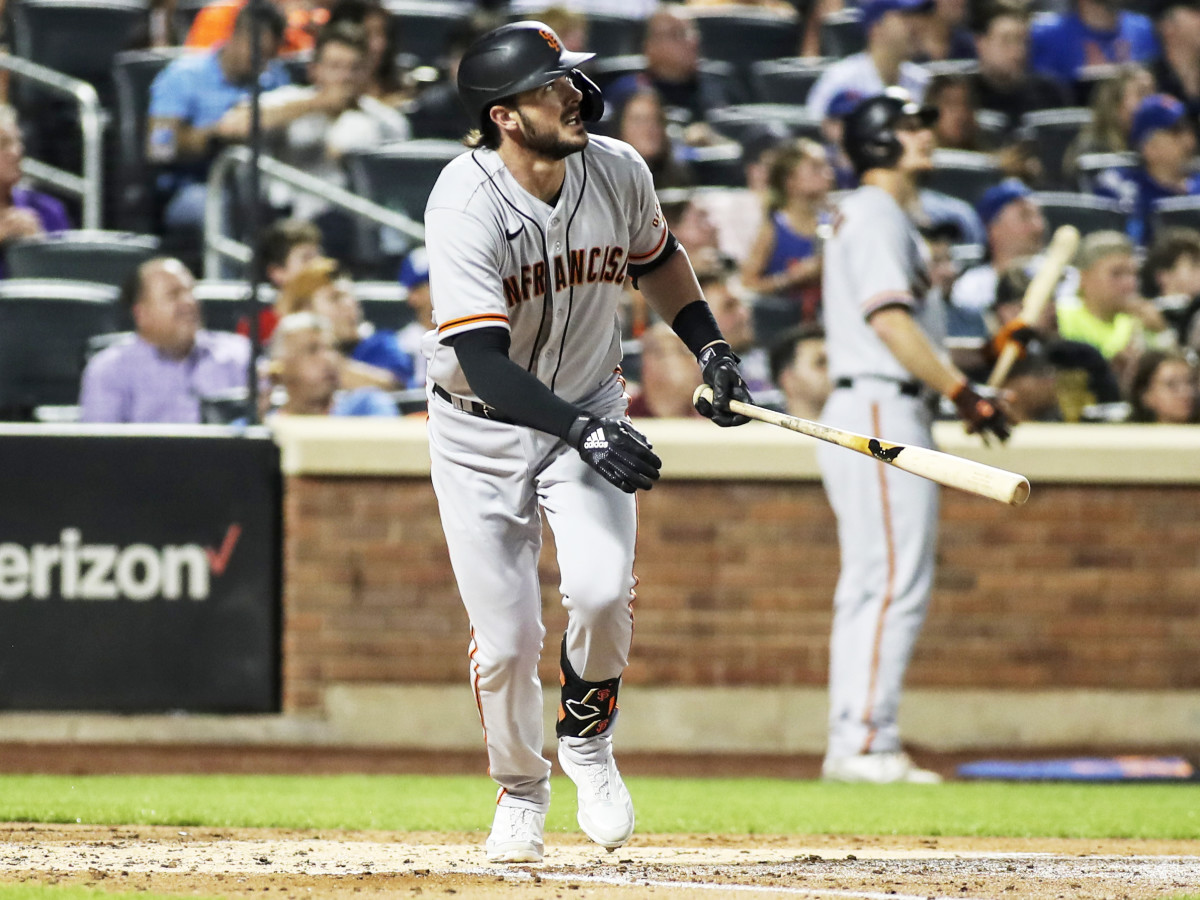 Aug 25, 2021; New York City, New York, USA;  San Francisco Giants third baseman Kris Bryant (23) hits a solo home run in the fourth inning against the New York Mets at Citi Field.