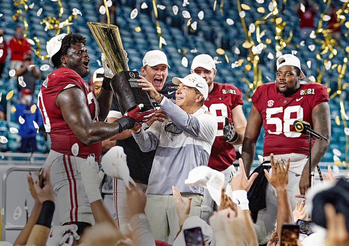 Nick Saban lifts the 2020 championship trophy for Alabama