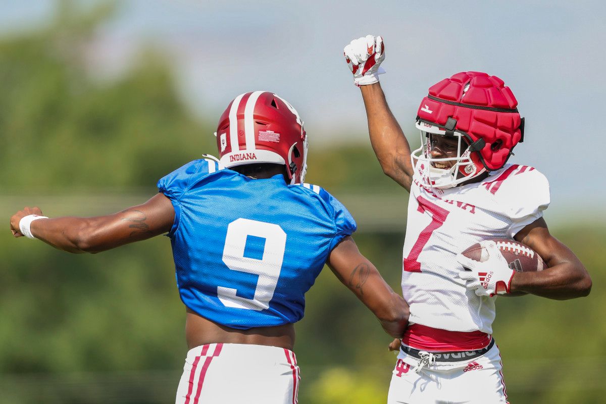 D.J. Matthews celebrates with Michael Penix Jr. during Indiana's fall camp on Aug. 20.