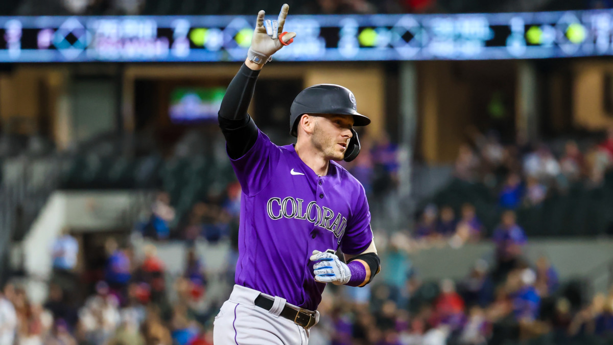 Aug 30, 2021; Arlington, Texas, USA; Colorado Rockies shortstop Trevor Story (27) reacts after hitting a home run during the seventh inning against the Texas Rangers at Globe Life Field.