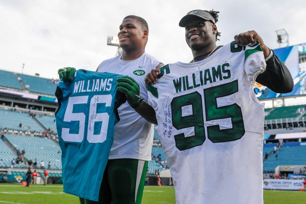 Jaguars LB Quincy Williams with Jets DT Quinnen Williams