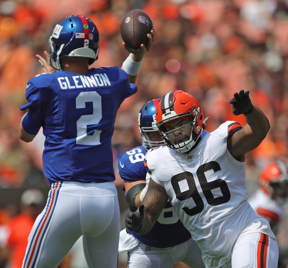 Cleveland Browns defensive tackle Jordan Elliott (96) rushes New York Giants quarterback Mike Glennon (2) during the first half of an NFL preseason football game, Sunday, Aug. 22, 2021, in Cleveland, Ohio. [Jeff Lange/Beacon Journal] Brownsgiants 4