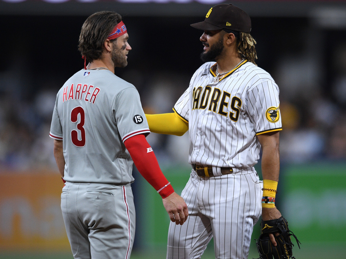 Philadelphia Phillies right fielder Bryce Harper (3) and San Diego Padres center fielder Fernando Tatis Jr. (right) talk during the middle of the sixth inning at Petco Park.