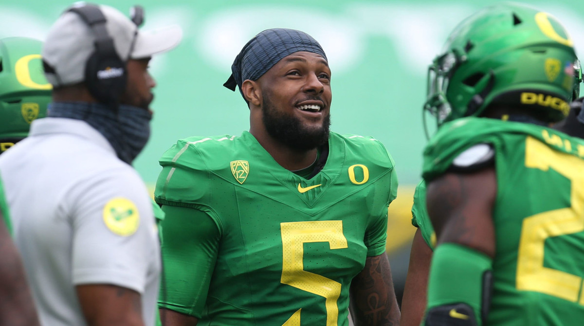 Oregon's Kayvon Thibodeaux, center, jokes with teammates during the Oregon Spring Football game at Autzen Stadium.