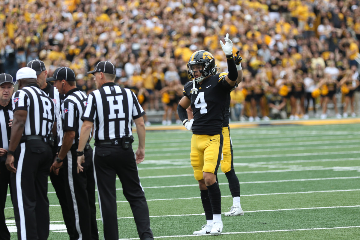 Iowa safety Dane Belton helps officials with a call  during a game against Indiana on Sept. 4, 2021 at Kinnick Stadium.