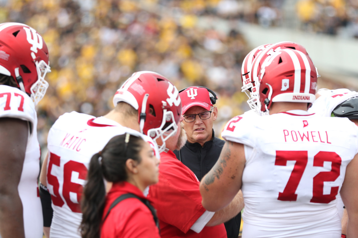 Indiana coach Tom Allen listens on headset during his team's game at Iowa on Sept. 4, 2021.
